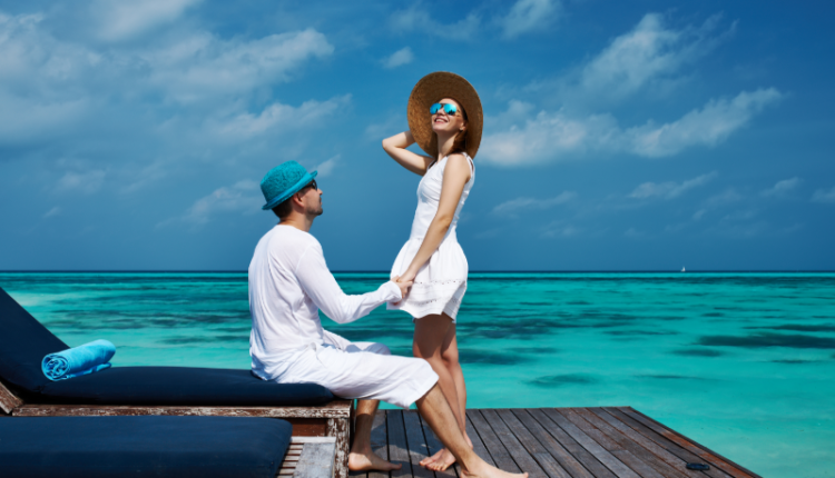 Image: Stunning aerial view of the Maldives showcasing turquoise waters, luxury resorts, vibrant restaurants, local cuisine, and exciting activities, encapsulating the essence of a Maldives tour.