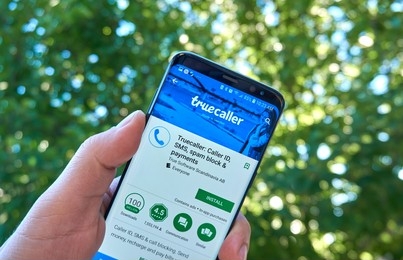 Image: Illustration depicting a smartphone screen with Truecaller app icon and a delete button, symbolizing the process of deleting a Truecaller account and removing associated phone numbers.