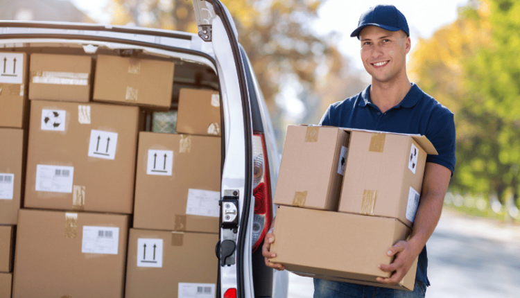 Image showing an Amazon delivery boy with a delivery package, representing the topic of Amazon delivery boy salary and how to become one.