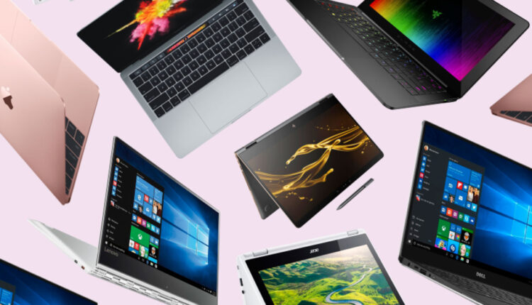 A selection of budget laptops displayed on a table, showcasing affordable options for high performance as discussed in the blog.