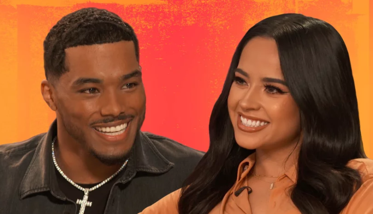 Rome Flynn smiling on a red carpet, dressed in a stylish suit, representing his roles in various movies and TV shows.