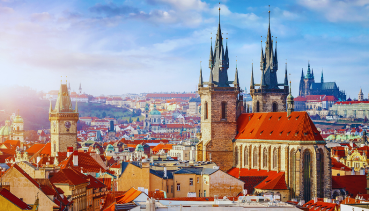 A picturesque view of Prague's skyline featuring iconic landmarks like the Charles Bridge and Prague Castle. The image includes icons representing hotels, restaurants, flights, a map, and a calendar, symbolizing comprehensive travel information. This visually represents the blog's detailed Prague Tour Guide on hotels, restaurants, flights, maps, and the best time to visit Prague.